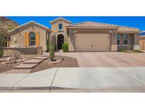 Charming single-Gathering home with a two-car garage and low-maintenance desert landscaping at 27562 N 99Th Dr, Peoria, AZ 85383