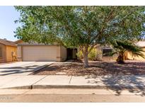 Charming home featuring low maintenance landscaping, mature trees, and an attached two car garage at 3018 W Country Club Ter, Phoenix, AZ 85027