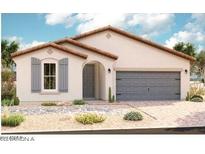 Charming single-story home featuring a neutral color palette, arched entryway, and a convenient two-car garage at 40579 W Michaels Dr, Maricopa, AZ 85138