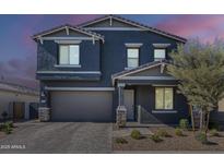 Charming two-story home with a paved driveway and desert landscaping at 9352 E Saturn Ave, Mesa, AZ 85212