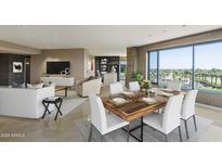 Bright and airy living room with large windows, a modern fireplace, and a stylish dining area with seating for six at 1040 E Osborn Rd # 501, Phoenix, AZ 85014