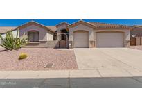 Charming single story home featuring a two car garage and well maintained desert landscaping at 11312 E Enrose St, Mesa, AZ 85207