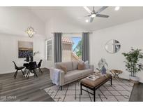 Inviting living room features vaulted ceilings, neutral tones, and ample natural light at 1633 E Lakeside Dr # 127, Gilbert, AZ 85234