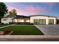 Stunning modern home with a two-car garage and well-maintained landscaping at 2225 N 38Th Way, Phoenix, AZ 85008