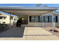 Charming home exterior with covered parking and low-maintenance landscape at 2233 E Behrend Dr # 29, Phoenix, AZ 85024