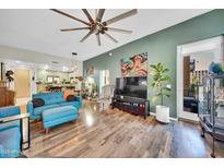 Bright living room features hardwood floors, modern ceiling fan, and colorful decor at 2302 N Central Ave # 311, Phoenix, AZ 85004