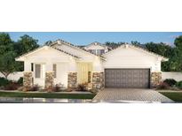 Charming single-story home with stone accents, a neutral palette, and a spacious two-car garage at 2559 E Virginia Cir, Mesa, AZ 85213
