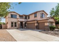 Spacious two-story home with three-car garage and neutral stucco exterior at 4507 E Lantern Pl, Gilbert, AZ 85297