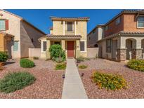 Charming two-story home with a well-maintained front yard and desert landscaping at 5 N 87Th Ln, Tolleson, AZ 85353
