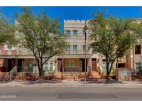 Charming townhome exterior featuring inviting front porches and neat landscaping at 581 S Roosevelt St, Tempe, AZ 85281