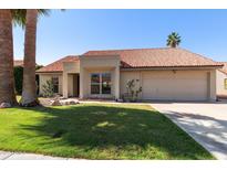 Charming single story home with a red tile roof, a two car garage, and desert landscaping in front at 5841 W Kesler St, Chandler, AZ 85226