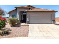 Charming single-story home with a two-car garage, desert landscaping, and a classic tile roof at 1501 E Sunland Ave, Phoenix, AZ 85040