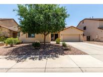 Charming single-story home featuring a well-manicured front yard and inviting curb appeal at 17937 W Westpark Blvd, Surprise, AZ 85388