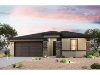 Charming single-story home featuring stone accents, a two-car garage, and desert landscaping at 19265 N Los Gabrieles Way, Maricopa, AZ 85138