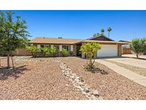 Charming single-story home with desert landscaping and a two-car garage at 3747 W Aire Libre Ave, Phoenix, AZ 85053