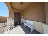 Inviting front porch with seating and a 'Welcome' sign, creating a cozy entrance at 4088 N 309Th Cir, Buckeye, AZ 85396