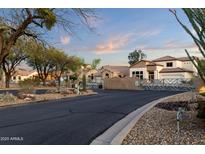 Gated community entrance with desert landscaping, and tile roofed homes at Vista Point in Scottsdale, Arizona at 9548 E Kiva Ln, Gold Canyon, AZ 85118