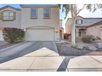 Well-maintained two-story home featuring a two-car garage and neutral stucco exterior at 13585 N 87Th Dr, Peoria, AZ 85381