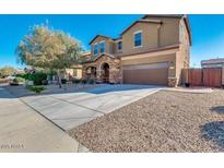 Charming two-story home with attached two-car garage and well-maintained front yard at 15105 W Glenrosa Ave, Goodyear, AZ 85395