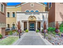 Welcoming community center entrance featuring stone accents, manicured landscaping, and convenient access for residents at 15817 S 177Th Dr, Goodyear, AZ 85338