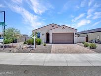 Inviting single-story home featuring desert landscaping, a paved driveway, and a well-kept front yard with great curb appeal at 15817 S 177Th Dr, Goodyear, AZ 85338