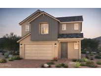 Charming two-story home with a two-car garage and beautifully landscaped front yard at 16442 W Whispering Wind Dr, Surprise, AZ 85387