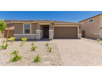 Charming single-story home with desert landscaping and a brick driveway at 18773 E Panchito Dr, Gold Canyon, AZ 85118