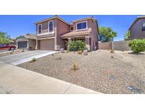 Charming two-story home featuring a low-maintenance front yard and a two-car garage at 43822 W Baker Dr, Maricopa, AZ 85138