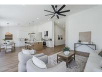 Open-concept living space with seamless flow between the kitchen and living areas at 7144 E Lakeview Ave, Mesa, AZ 85209