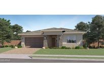 Charming single-story home with stone accents, a two-car garage and a neatly landscaped front yard at 870 W Peralta Pass, Apache Junction, AZ 85120