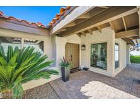 Inviting front entrance featuring a terracotta roof, double doors, and desert landscaping at 10023 E Sunnyslope Ln, Scottsdale, AZ 85258
