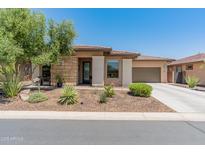 Beautiful single-story home with desert landscaping and a light tan exterior at 13186 W Via Dona Rd, Peoria, AZ 85383