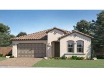 Charming single-story home featuring a tile roof, two-car garage, and professionally landscaped front yard at 1415 W J Waltz Way, Apache Junction, AZ 85120