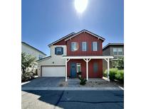 Charming two-story home with red accents, blue shutters, and a welcoming front porch at 15718 W Polk St, Goodyear, AZ 85338