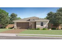 Charming single-story home with a two-car garage, stone accents, and a well-manicured front yard at 20872 S 231St Pl, Queen Creek, AZ 85142