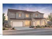 Stunning two-story home showcasing a neutral color palette, two-car garage, and well-manicured landscaping at 25845 S 227Th St, Queen Creek, AZ 85142