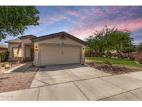 Charming single-story home with a two-car garage and well-maintained landscaping at 30259 N Sunray Dr, San Tan Valley, AZ 85143