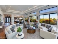 Bright, open living room with large windows and designer furnishings throughout home at 6512 N 31St Way, Phoenix, AZ 85016
