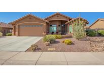 Charming single-story home featuring a desert landscaped yard and covered front patio seating area at 11242 E Onza Ave, Mesa, AZ 85212