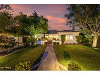 Charming single-Gathering home with mature trees, lush lawn, and brick pathway leading to the entrance at 1625 N 11Th Ave, Phoenix, AZ 85007