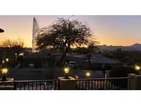 Tranquil backyard view featuring a fountain and desert landscaping at sunset at 17214 E Alta Loma --, Fountain Hills, AZ 85268