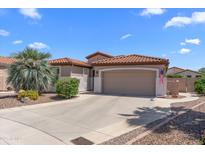 Charming single-story home with a red tile roof, desert landscaping, and a two-car garage at 4239 E Azalea Dr, Gilbert, AZ 85298