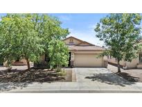 Charming single story home with a lush front yard and two car garage at 5303 W Hackamore Dr, Phoenix, AZ 85083