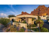 Modern home exterior featuring desert landscaping and striking views of Camelback Mountain at 5905 N Echo Canyon Ln, Phoenix, AZ 85018