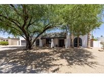 Charming single-story home featuring desert landscaping and unique architectural details at 7020 E Friess Dr, Scottsdale, AZ 85254