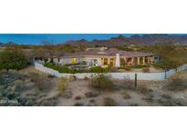 Expansive desert property with a resort-style pool and mountain views provides the perfect backdrop for relaxed living at 9045 E Chino Dr, Scottsdale, AZ 85255