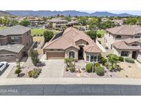 Beautiful single-Gathering home featuring desert landscaping, a fountain, and a neutral color palette at 9722 S 45Th Ave, Laveen, AZ 85339