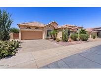 Charming single-story home featuring a desert landscape and a two-car garage at 9722 S 45Th Ave, Laveen, AZ 85339