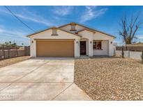 Charming single-story home featuring a low-maintenance yard and attached two-car garage at 11474 N 79Th Dr, Peoria, AZ 85345