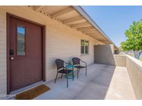 Inviting front porch with seating, perfect for enjoying the outdoors at 1219 E Colter St # 8, Phoenix, AZ 85014